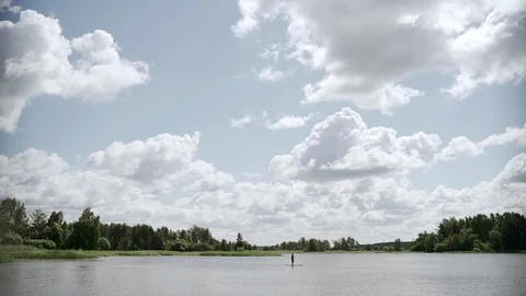 Small group stand up paddle boarding on SUP board slow motion video. Stock Footage 112165691