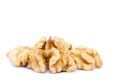 Small group of walnuts on a white background. Stock Photos