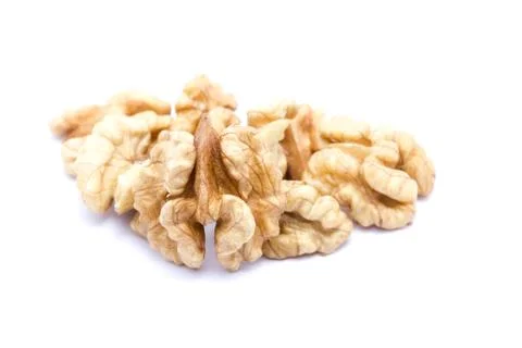 Small group of walnuts on a white background. Stock Photos