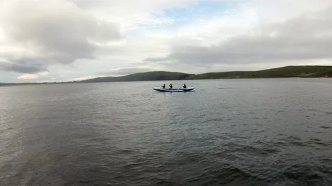 Small group of young people kayaking across a lake. Stock Footage 88341887