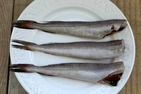 Small hakes on plate Foto stock