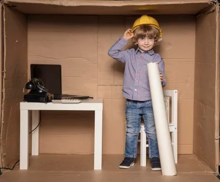 Small happy engineer in his small office Stock Photos