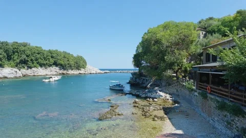 The small harbor at Damouhari in Pelion, Greece, showing clear blue sea Stock Footage 346676947