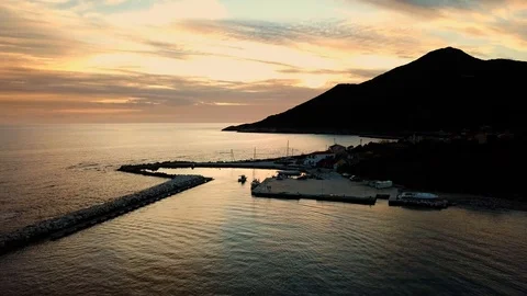 Small harbor on a remote island at sunset Stock Footage 108719398