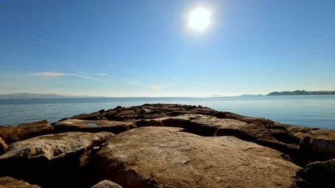 Small harbour made of rocks with a calm sea on a sunny day in Rianxo Stock Footage 171271140