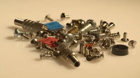A small heap of computer screws spinning 動画素材 61440945