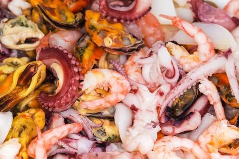 Small heap of mix of different boiled seafoods close-up Фото