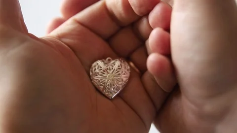 Small heart in the hands Stock Footage 123490491