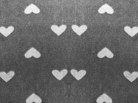 Small heart mirror affect image. geometric seamless pattern, black blur. Stock Photos