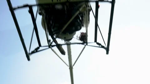 Small helicopter is flying over at short range Stock Footage 101678936