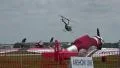 Small Helicopter Takes Off At Air Port With WW2 Airplanes In Foreground HD Footage