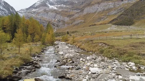 A small high mountain river Stock Footage 129358104