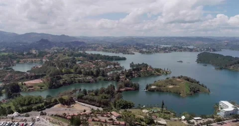 Small Hills Surrounded by Tiny Islands, Boats and Houses Video stock 165837780