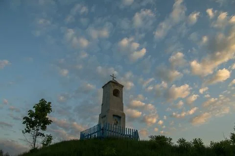 Small Hilltop Chapel Under Dramatic Evening Clouds Stock Photos