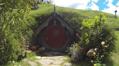 Small hobbit hole with red door Stock Footage 48213071