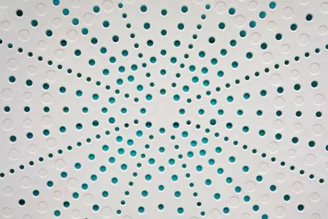 Small holes in several rows. Tray for water drainage, close Stock Photos