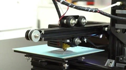 Small home 3D printer prints plastic toy  filament Stock Footage 84042126