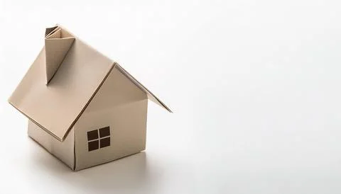 Small home downsizing concept paper origami isolated on white background wi.. Stock Photos