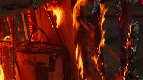Small home engulfed in flames with a large fire. Footage of large flames. Fire Stock Footage 232336558