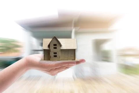 Small home model on hand white background Stock Photos
