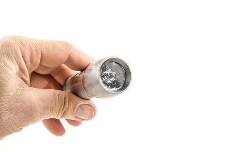 Small home pocket led flashlight in hand on the white Stock Photos