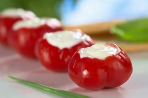 Small hot red pepper filled with cream cheese Stock Photos