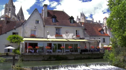 Small hotel overlooking river with waterfall Stock Footage 50340114