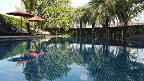 Small hotel resort pool area with no people Video stock 107353475