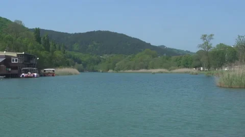 Small hotel on Vulan mountain river coast in Arkhipo-Osipovka with boats at pier Stock Footage 155116178