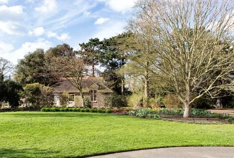 Small house between the trees in the park Stock Photos