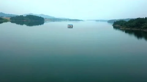 Small house floating in the lake Stock Footage 235131674