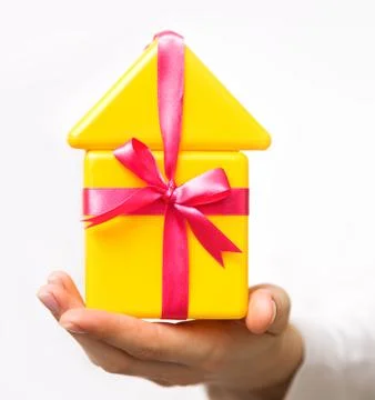 Small house in a hand Stock Photos