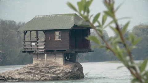 Small House in the River, standing on a Stone Close up Vídeo Stock 92663631