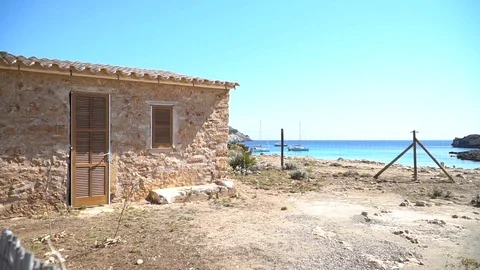 Small house by the sea Stock Footage 128347466
