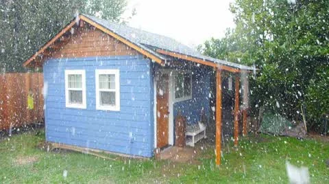 Small House with Snowfall Stock Footage 10716034