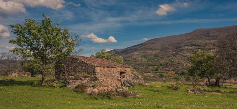 Small house of stone Stock Photos