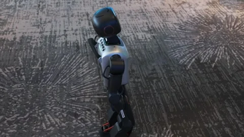 Small humanoid robot walking on patterned floor at public tech display Stock Footage 323367968