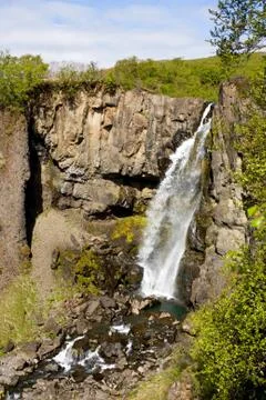The small Hundafoss is situated below the famous Svartifoss waterfall in the  Stock Photos