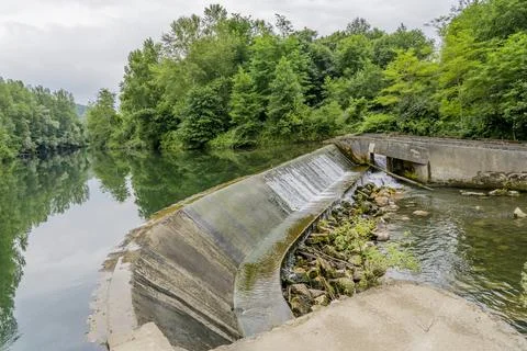 Small hydroelectric power plant in the river, France. Operating since the 60s Stock Photos