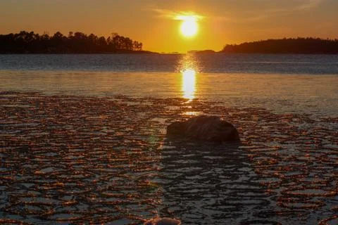 Small ice floats at sunset Stock Photos