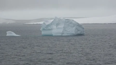 Small iceberg floating polar ocean Antarctica, 4K Stock Footage 332371559