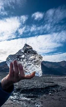 Small icebergs in one hand Stock Photos