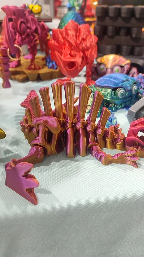 Small ichthyosaurus skeleton printed 3D printer molten plastic pink Vertical Stock Footage 303956090