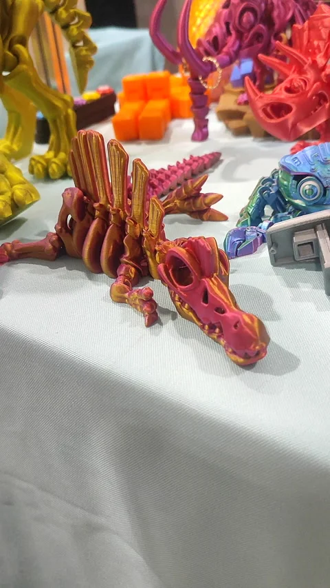 Small ichthyosaurus skeleton printed 3D printer molten plastic pink Vertical Stock Footage 303956118