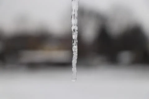 A small icicle with blurred background Stock Photos