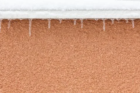 Small icicles in windowsill Stock Photos