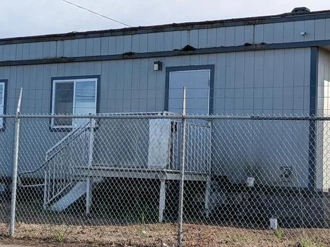 Small industrial structure within a secured construction yard Photos