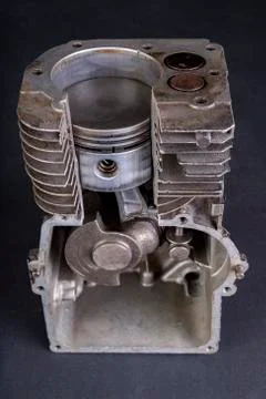 A small internal combustion engine shown in section. View of the piston and r Stock Photos