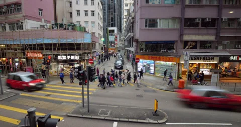 Small intersection at Wan Chai, time-lapse of city traffic in day Stock Footage 309402193