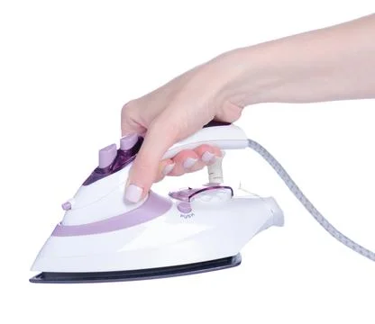 Small iron appliance in hand Stock Photos